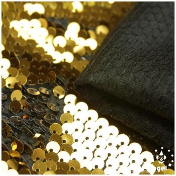 TELA DE RASO CON LENTEJUELAS REVERSIBLES ORO Y PLATA SERIE RAMÓN 135cm